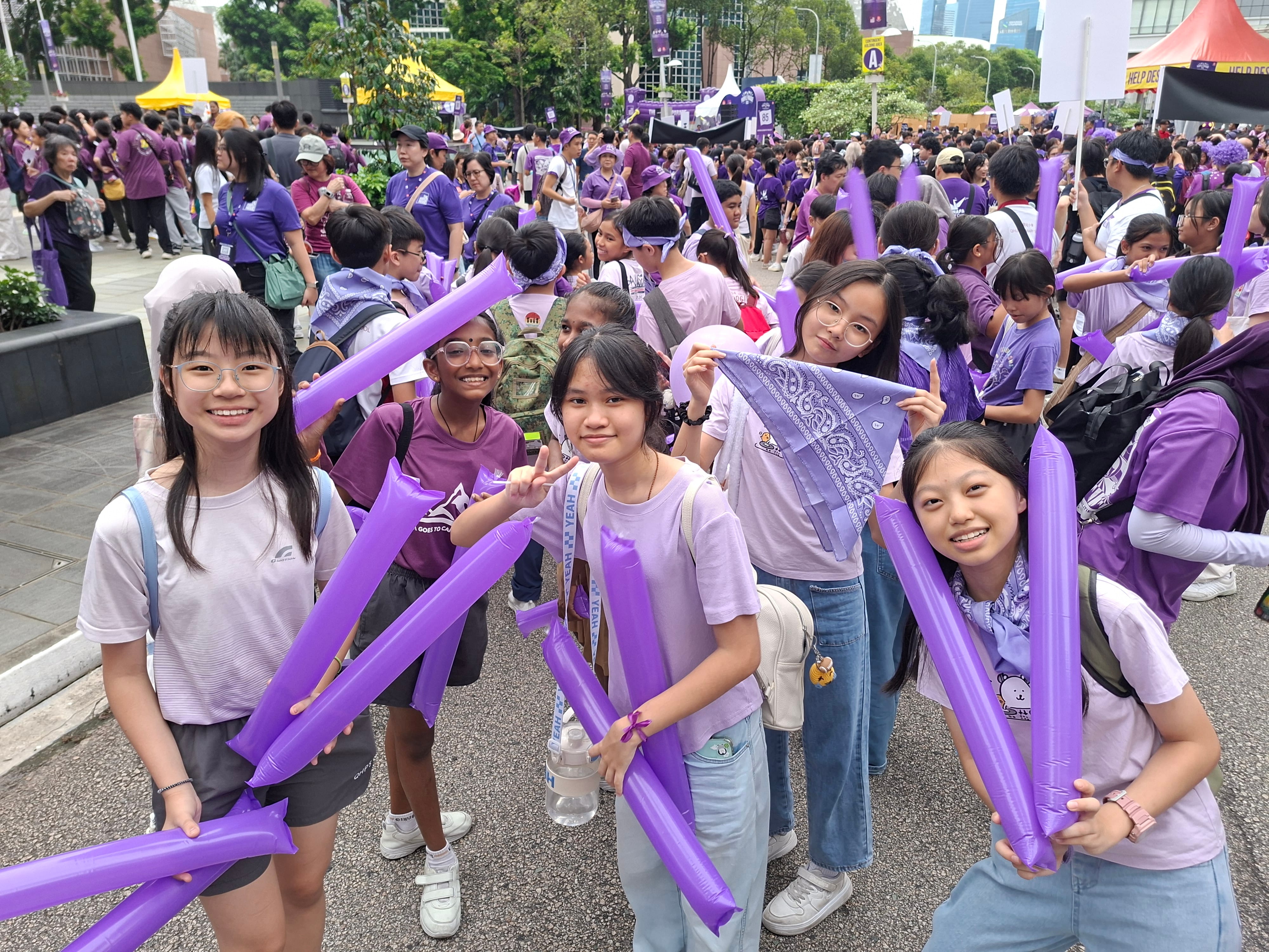 Students dressed in purple joining Purple Parade
